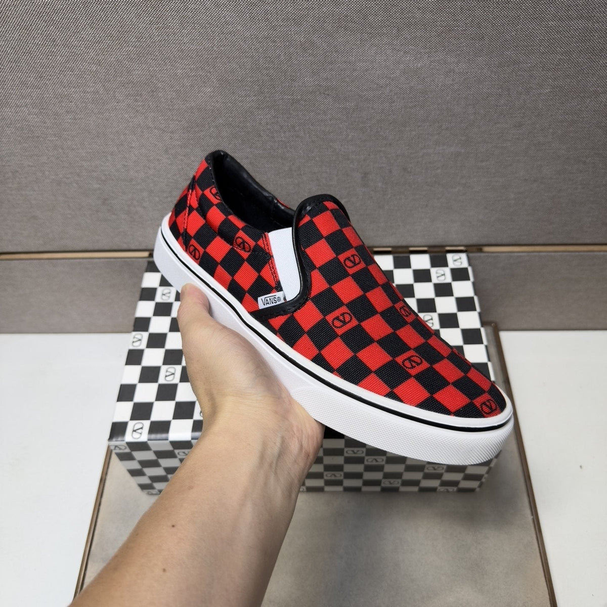 Vans Red and Black Checkerboard Slip-On Sneakers